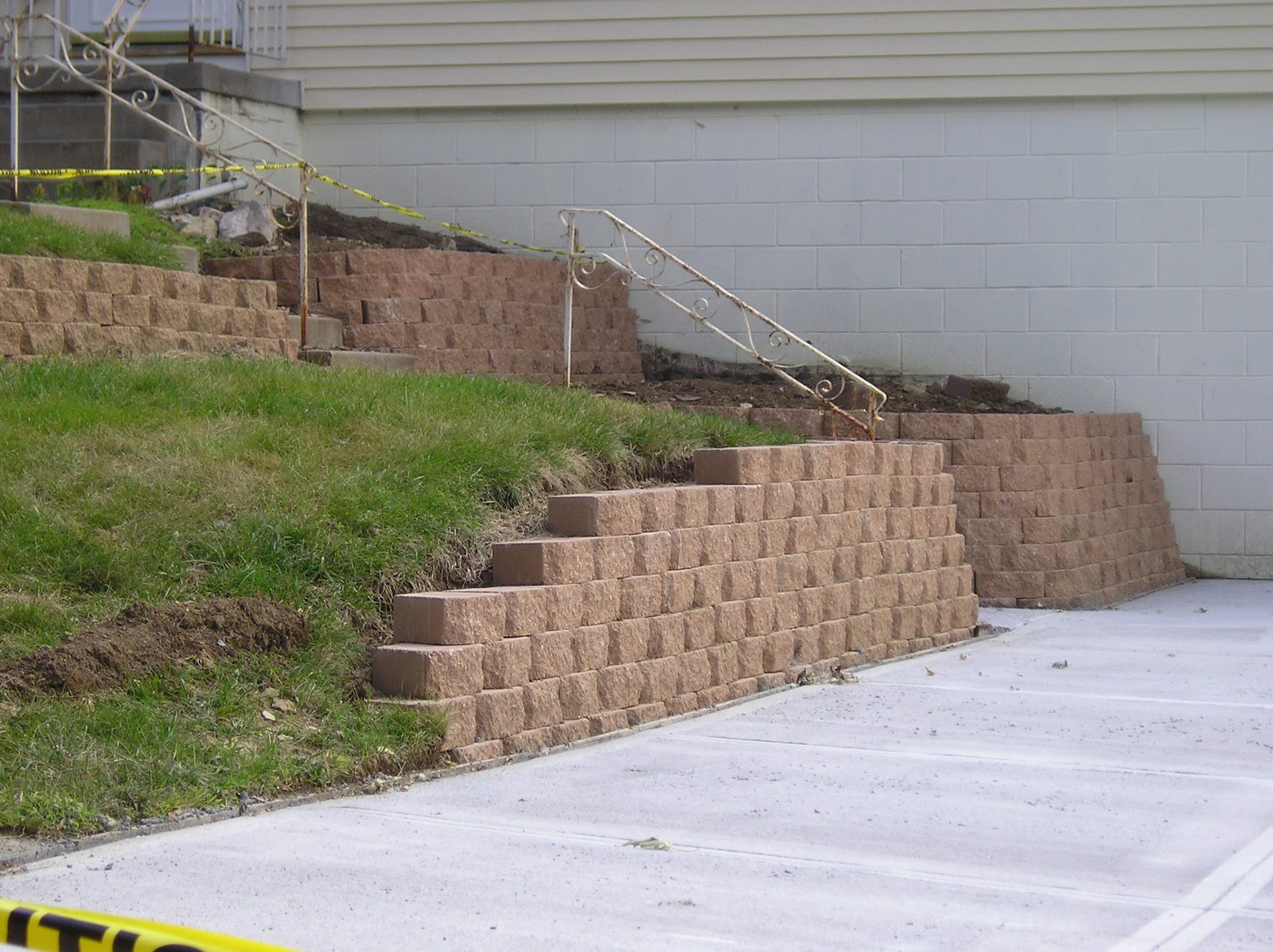 Retaining wall with steps and driveway
