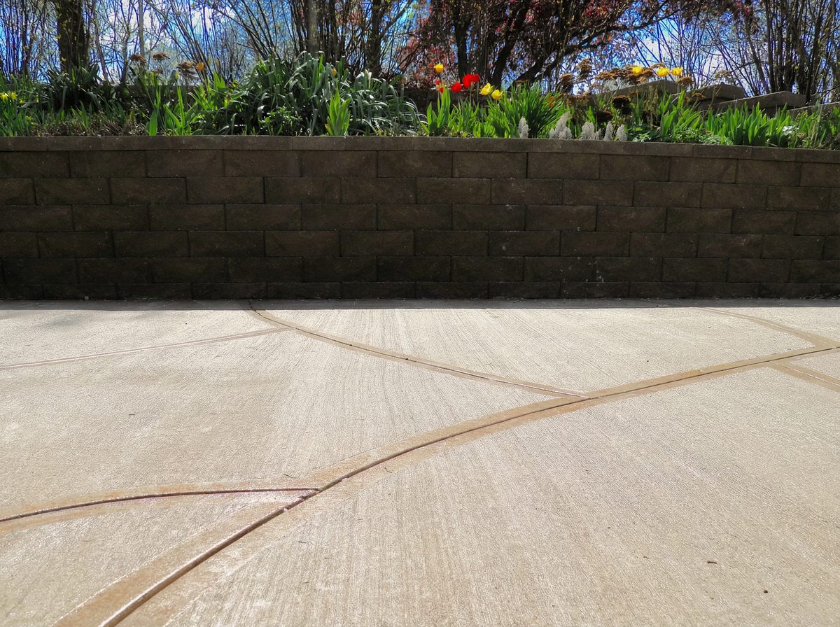 Stamped patio with garden wall